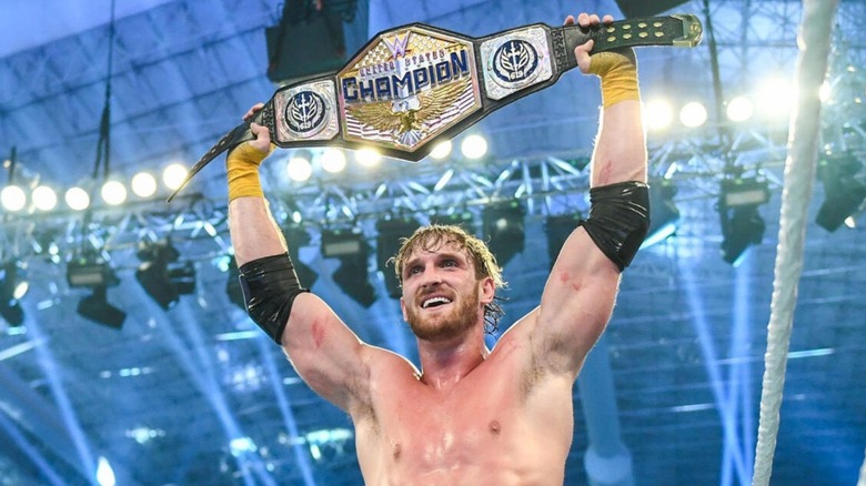 Logan Paul holds up the WWE United States Championship after defeating Rey Mysterio in Saudi Arabia.