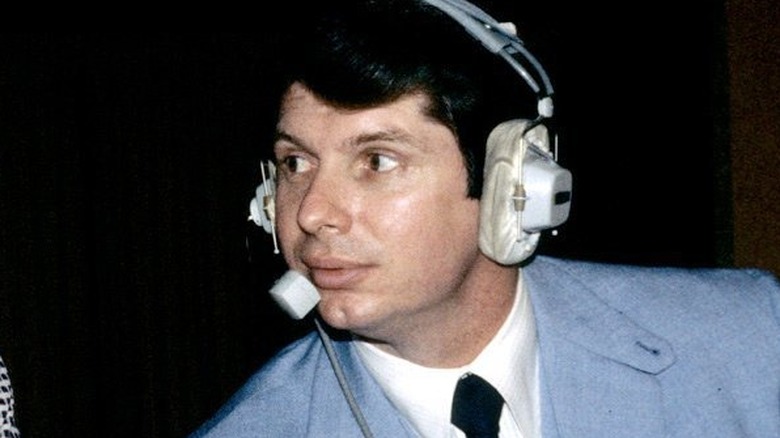 Vince McMahon with a headset on