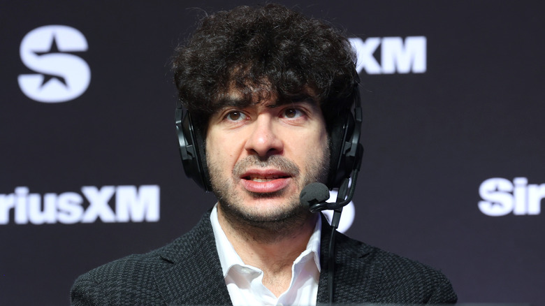 Tony Khan wearing a headset