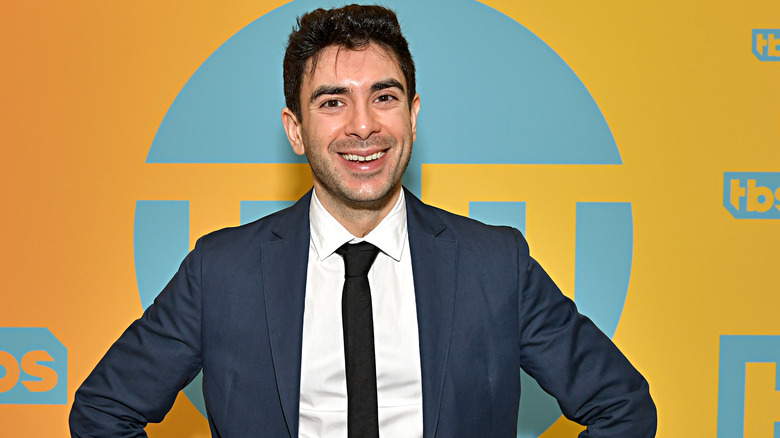 Tony Khan smiles and poses on the red carpet during a WBD event. (2019 TM & © Turner Entertainment Networks, Inc. A WarnerMedia Company)