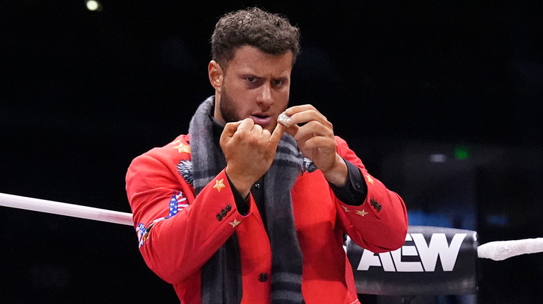 MJF putting on diamond ring in wrestling ring