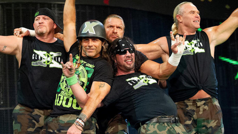 Road Dogg, Shawn Michaels, Triple H, Sean Waltman, and Billy Gunn pose together as D-Generation X