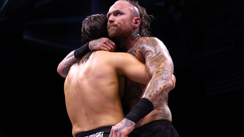 Malakai Blakc hugs Adam Cole