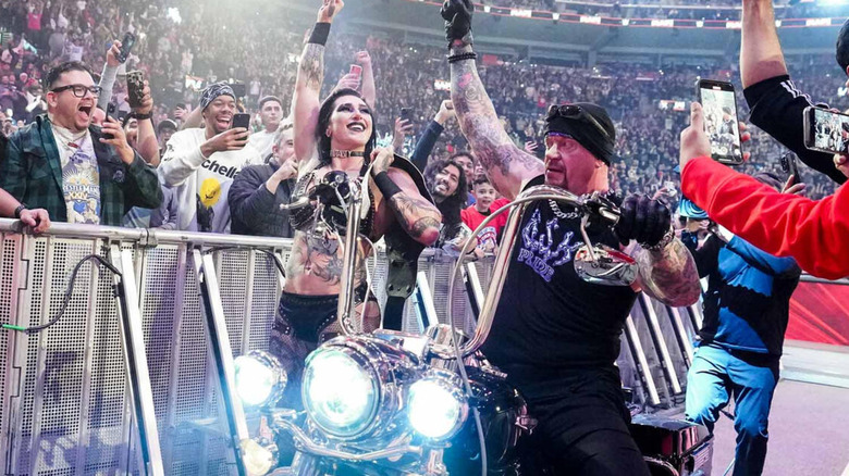 The Undertaker and Rhea Ripley celebrating on WWE Raw