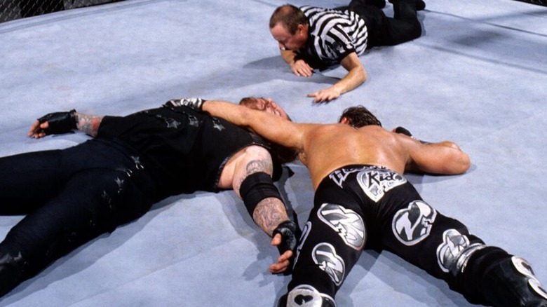 Shawn Michaels pins The Undertaker to win the first Hell in a Cell match