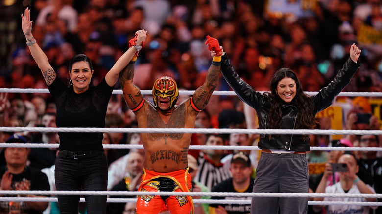 Angie, Rey, and Aalyah Mysterio celebrating 