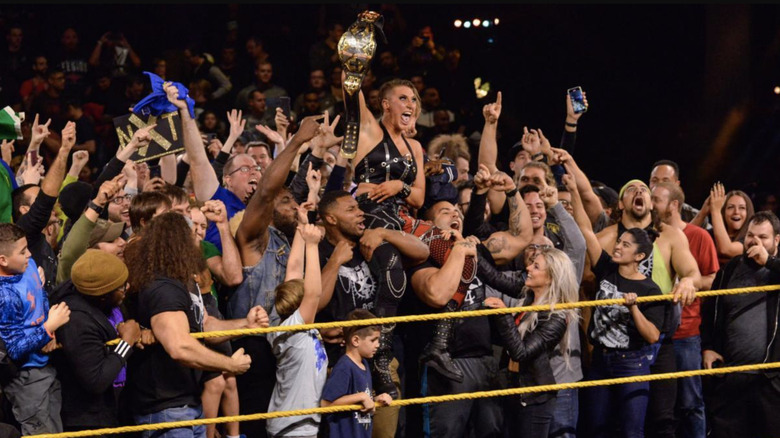 Rhea Ripley celebrating with fans