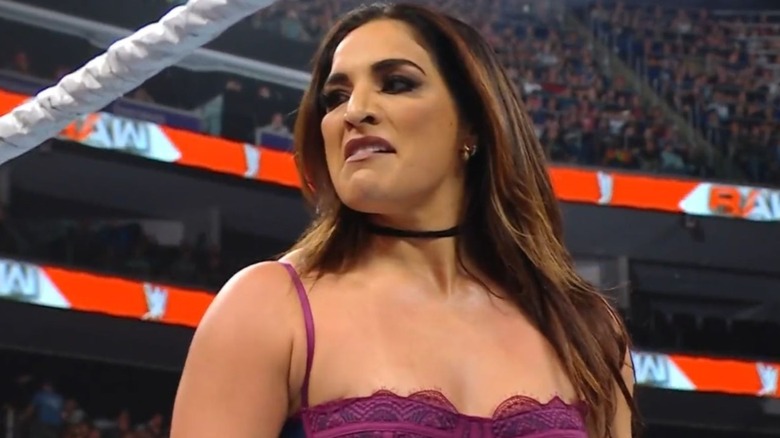 Raquel Rodriguez stands in the ring during "WWE Raw" after battering WWE Women's Champion Rhea Ripely and issuing a challenge for Payback.