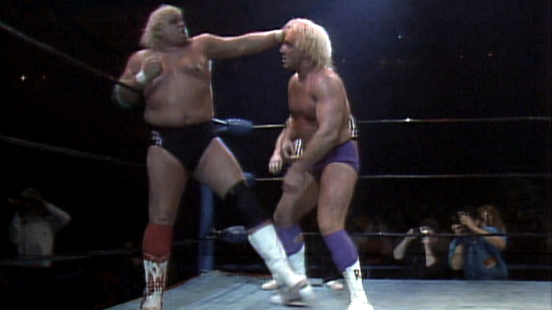 Dusty Rhodes punching Ric Flair