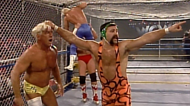 Wrestlers in WCW steel cage