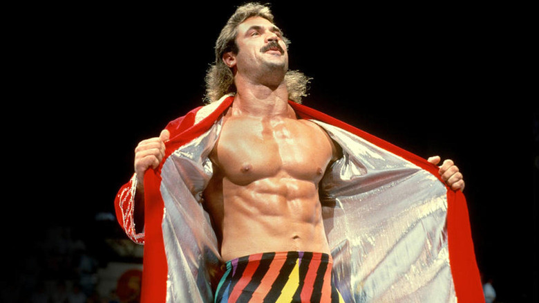 Rick Rude showing off his abs