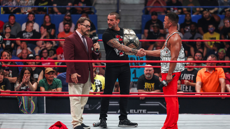 Ricky Starks shaking CM Punk's hand