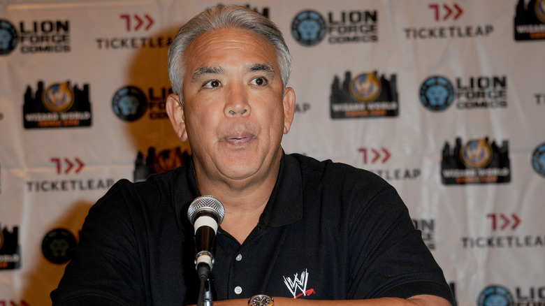 Ricky Steamboat in a WWE logo polo shirt.