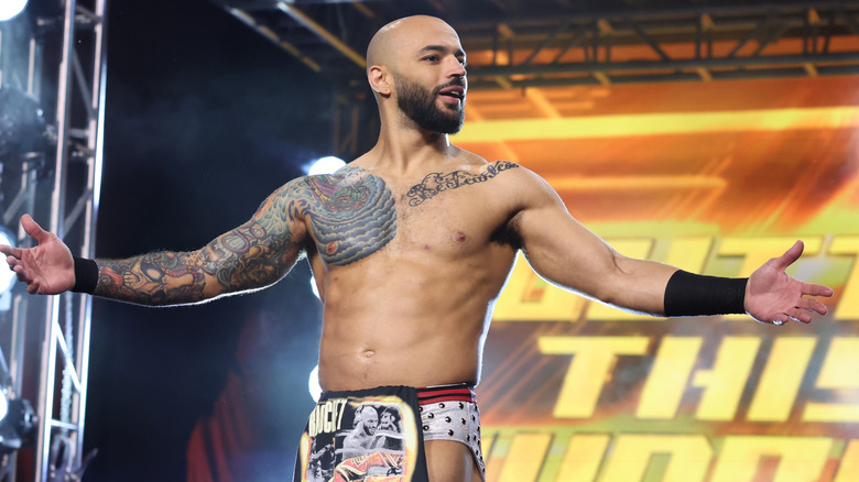 Ricochet poses on the stage before a Continental Classic match against Will Ospreay on 