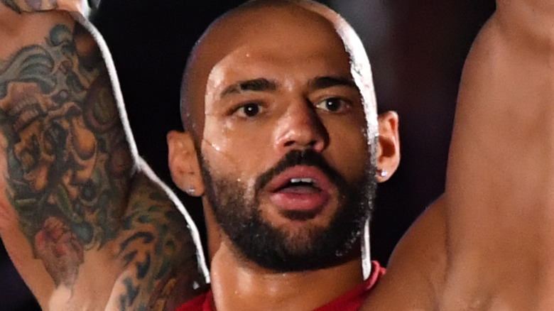 Ricochet holding up a championship