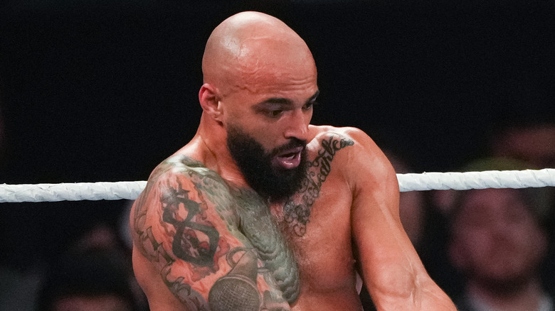 Ricochet extending his arms