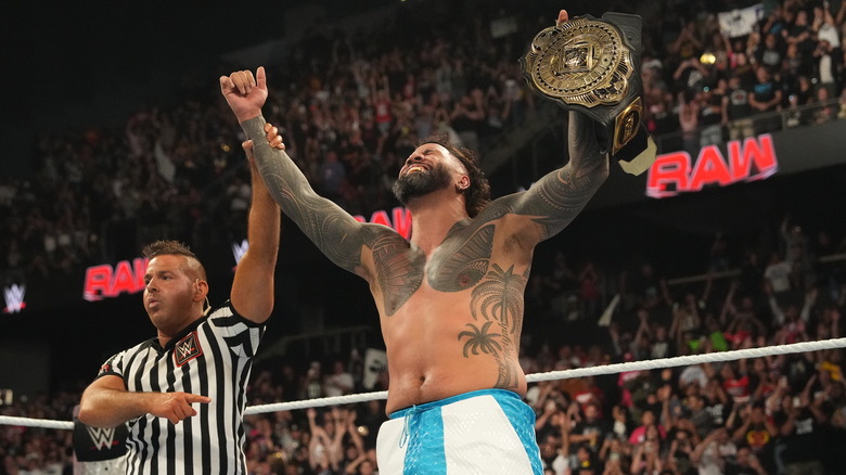 Jey Uso celebrating with WWE Intercontinental Championship