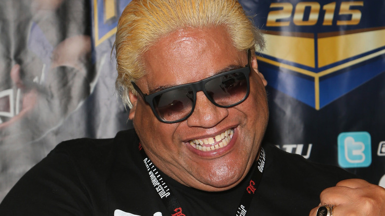 rikishi smiling at autograph signing