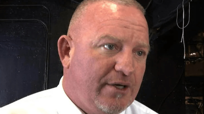 Brian "Road Dogg" James being interviewed backstage at a WWE event