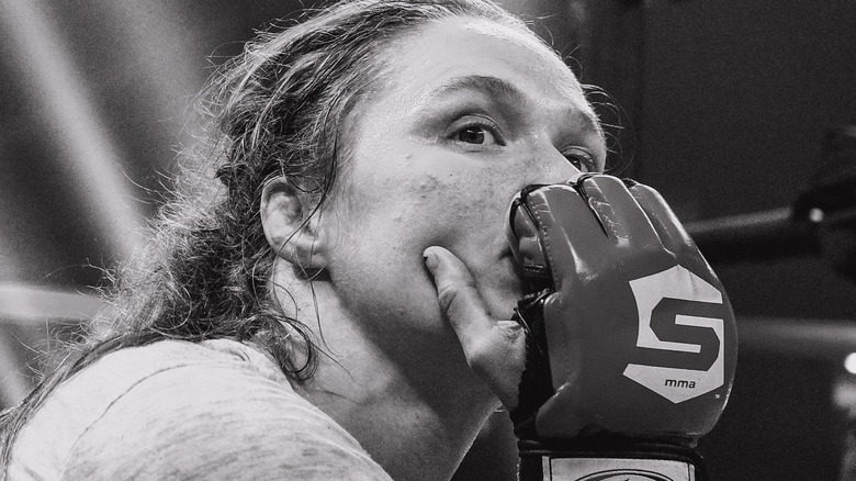 Ronda Rousey with her hand on her chin