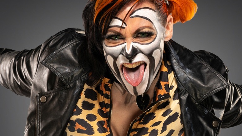 Rosemary poses for a camera backstage wearing face paint in TNA.