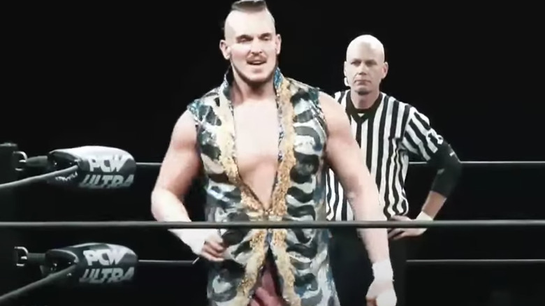 Sam Adonis in the ring with a referee