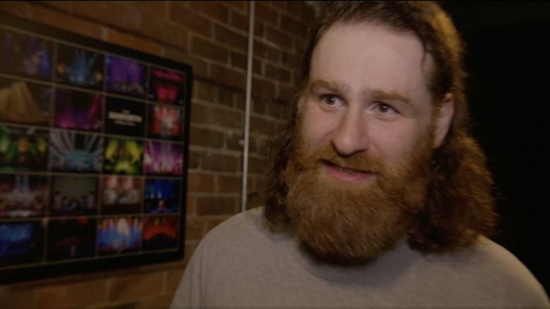 Sami Zayn gives interview with brick background