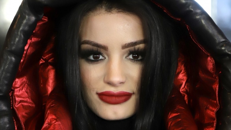 Saraya with her hood up