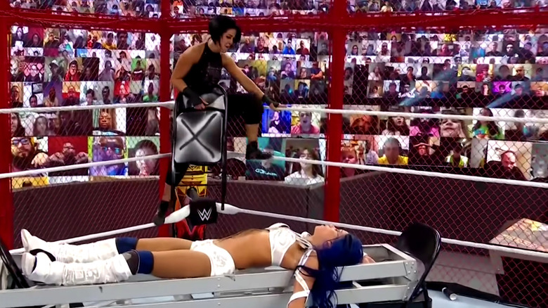Bayley holds chair, Sasha on ladder
