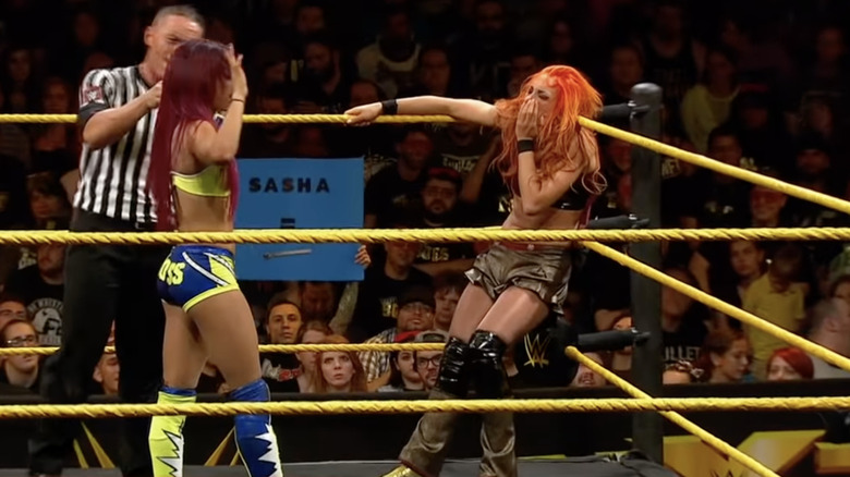 Sasha Banks backs off from attacking Becky Lynch