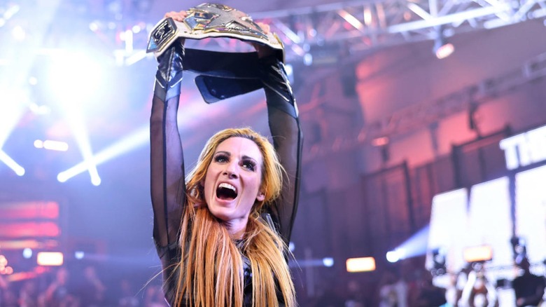 Becky Lynch celebrates winning the NXT Women's title