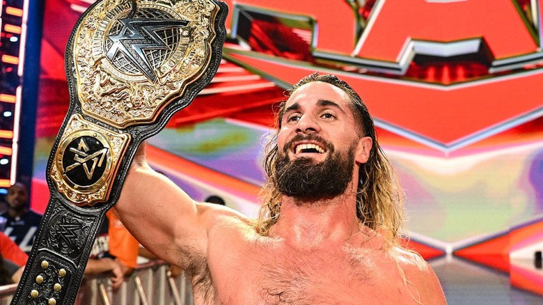 Seth Rollins shows off his World Heavyweight Championship.