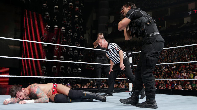 CM Punk laid out by Seth Rollins