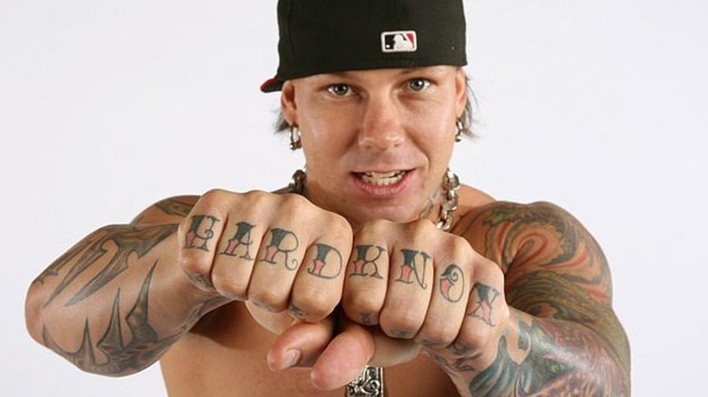 Shannon Moore showing off his tattoos