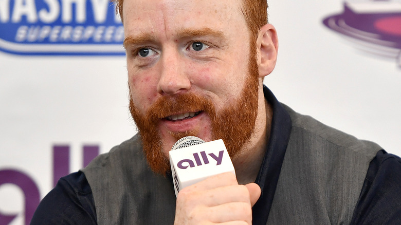 Sheamus speaking into microphone