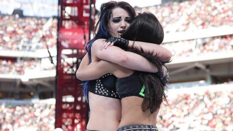 AJ Lee and Paige Hug In The Ring At WrestleMania 31