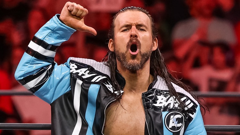 Adam Cole poses