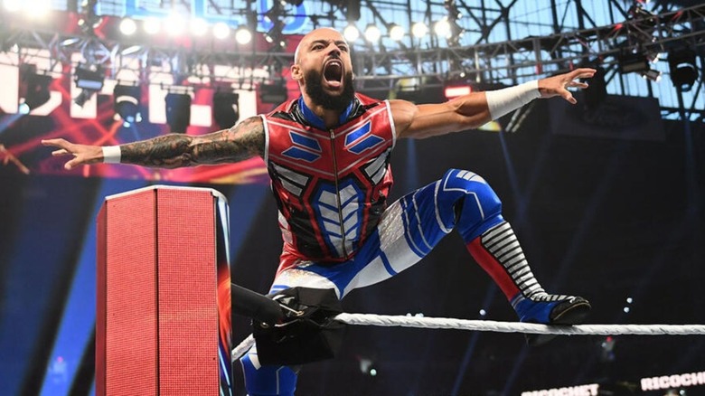 Ricochet poses for the WWE crowd while standing on the ropes before a match against Logan Paul.