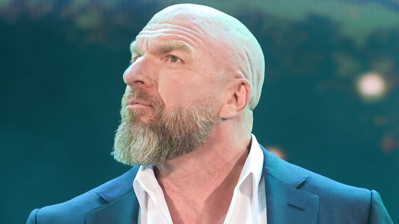 Triple H looks to his right