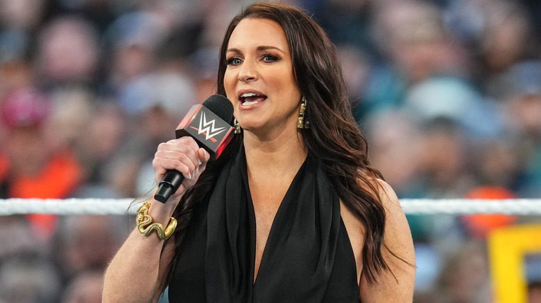 Stephanie McMahon holding a microphone