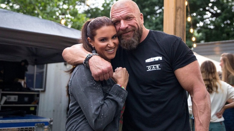 Stephanie McMahon hugging husband Paul "Triple H" Levesque