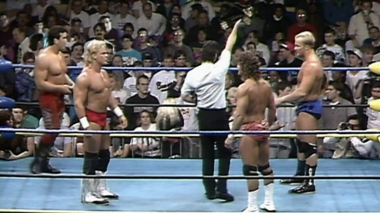 Ricky Steamboat and Shane Douglas in the ring with the Hollywood Blonds