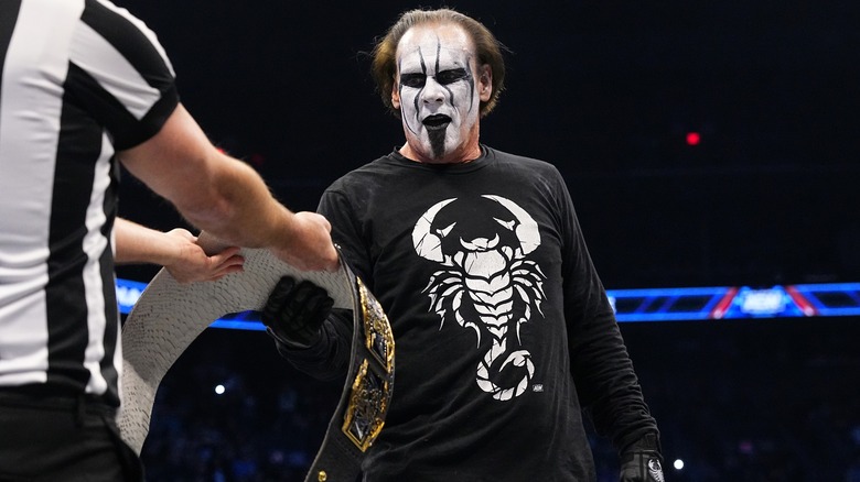 Sting accepting AEW World Tag Team Championship