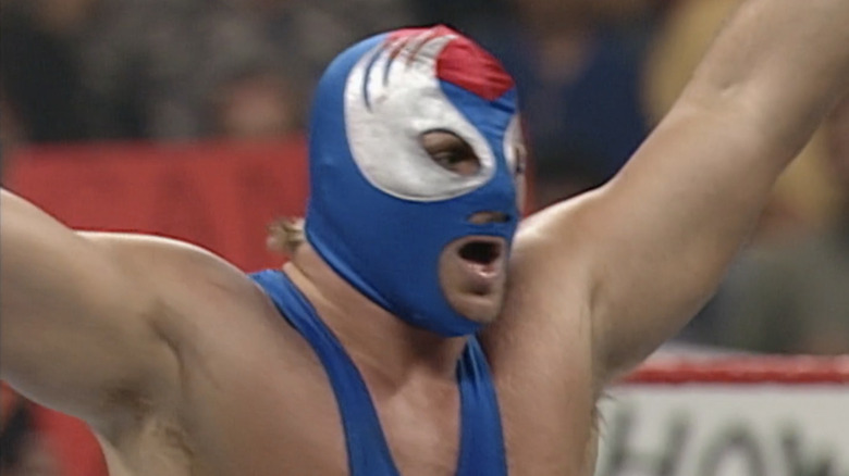 Owen Hart celebrates, dressed as the Blue Blazer