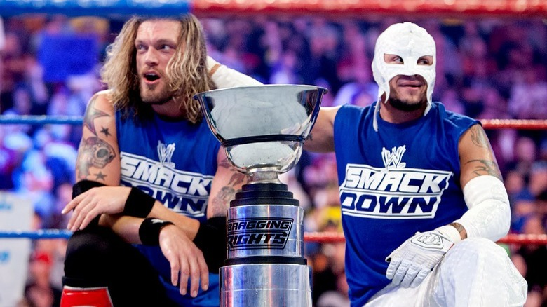 Edge and Rey Mysterio with the Bragging Rights trophy