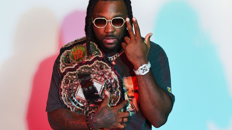 Swerve Strickland poses with title belt