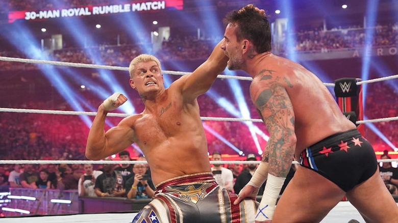 Cody Rhodes loads up for a right hand on CM Punk.