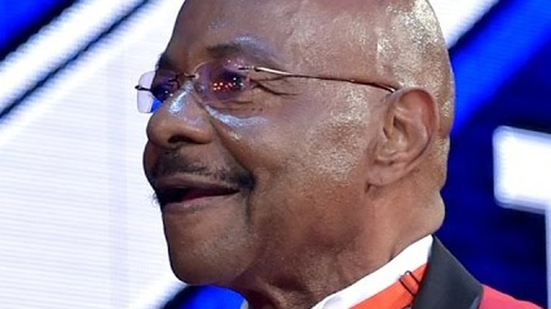 Teddy Long smiles 