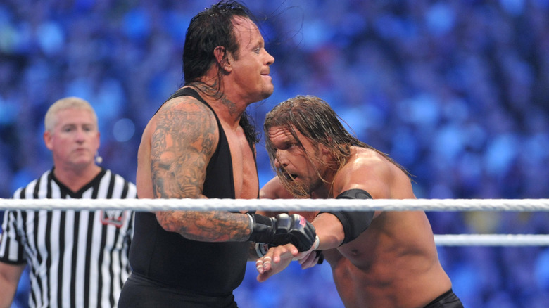 The Undertaker wrestles Triple H