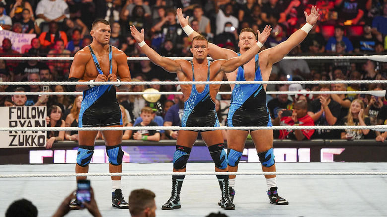 Chad Gable poses with the Creeds Brothers